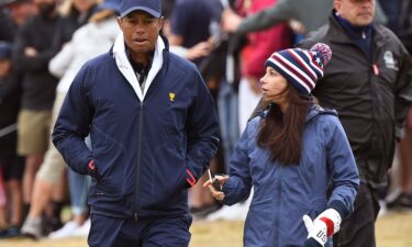 Tiger Woods and Erica Herman pictured during the third day of the Presidents Cup in Melbourne on December 14