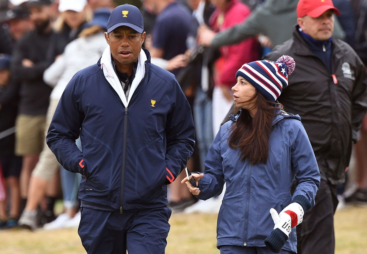 <i>William West/AFP/Getty Images</i><br/>Tiger Woods and Erica Herman pictured during the third day of the Presidents Cup in Melbourne on December 14