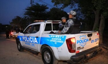 Police officers patrol Nueva Concepcion on May 17.