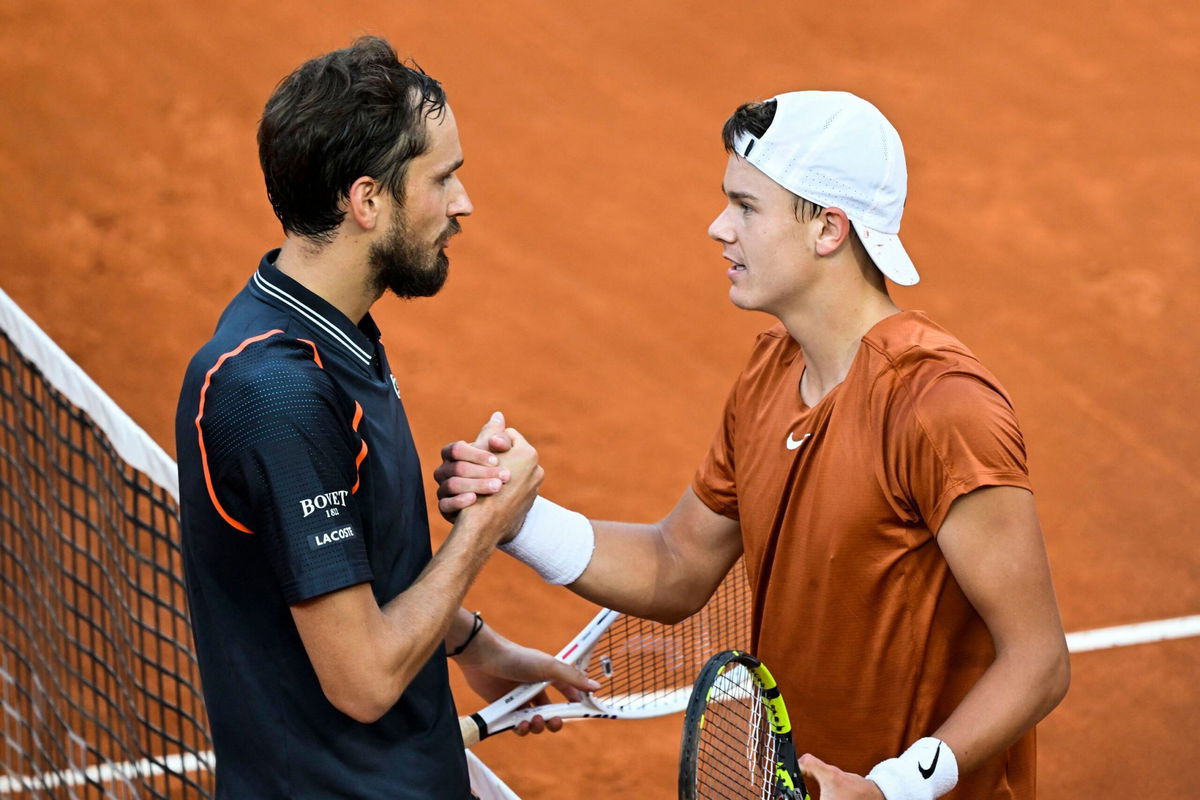 <i>Filippo Monteforte/AFP/Getty Images</i><br/>Medvedev (left) and Rune shake hands after the Italian Open final.