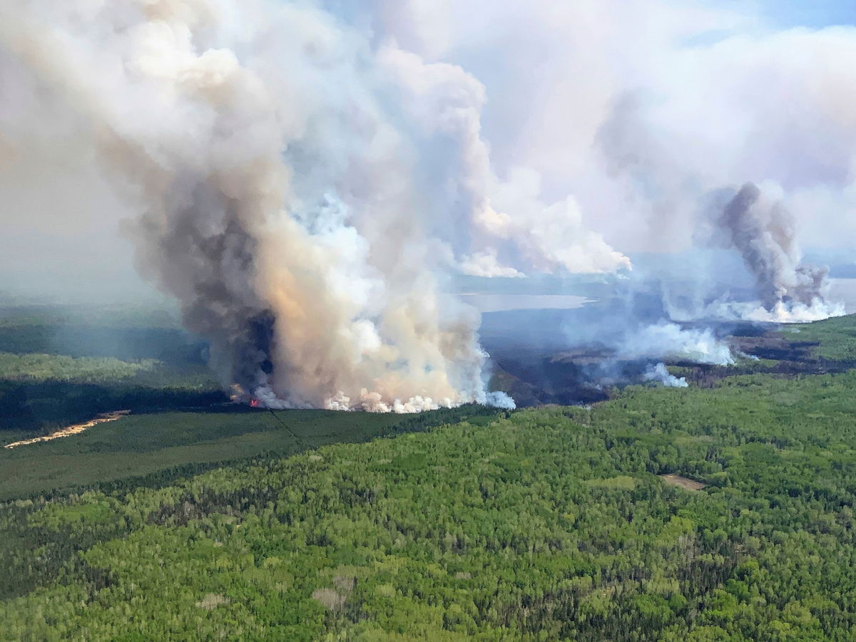 <i>Government of Alberta Fire Service/The Canadian Press/AP</i><br/>The Eagle Wildfire burns near Fox Creek