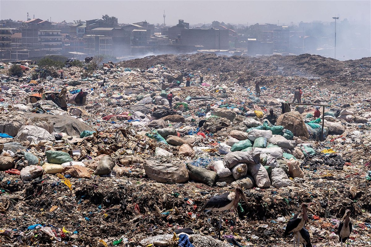 <i>Simone Boccaccio/SOPA Images/LightRocket/Getty Images</i><br/>People collecting plastic waste at Dandora dumpsite