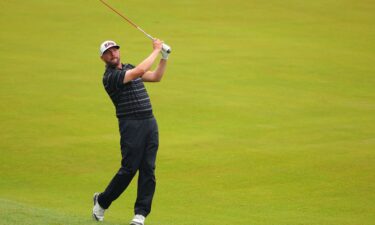 Block plays a shot on the 18th hole during his third round.