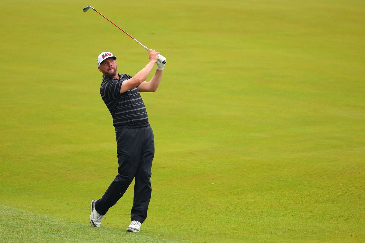 <i>Kevin C. Cox/Getty Images</i><br/>Block plays a shot on the 18th hole during his third round.