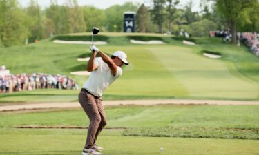 Koepka drives during the final round.