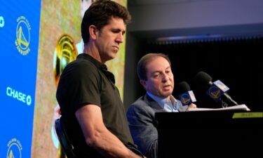 Bob Myers speaks at a press conference next to Golden State Warriors owner Joe Lacob (right).