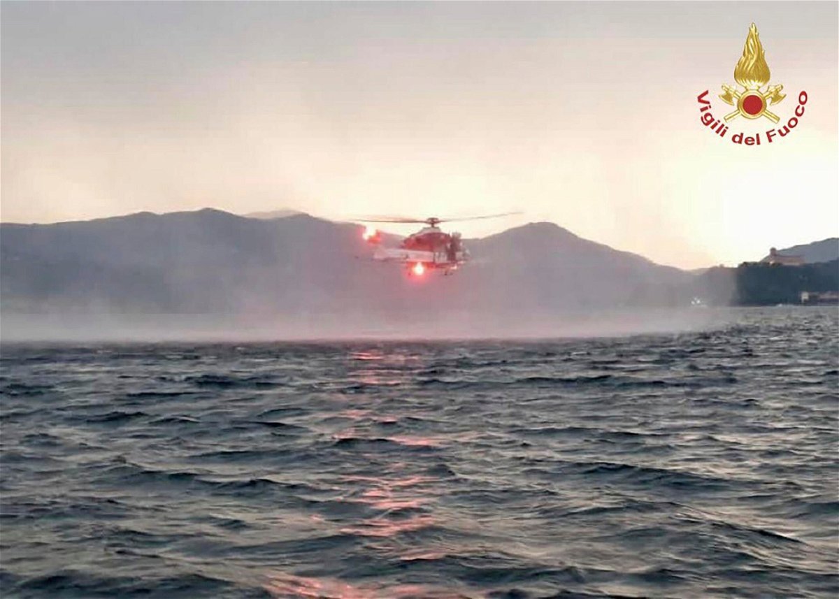 <i>Vigili Del Fuoco/AP</i><br/>A helicopter searched for missing passengers after the boat capsized.