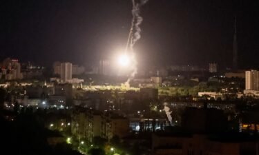 An explosion is seen in the sky over Kyiv during a Russian missile strike on May 16.