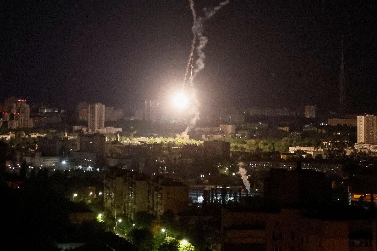 <i>Gleb Garanich/Reuters</i><br/>An explosion is seen in the sky over Kyiv during a Russian missile strike on May 16.
