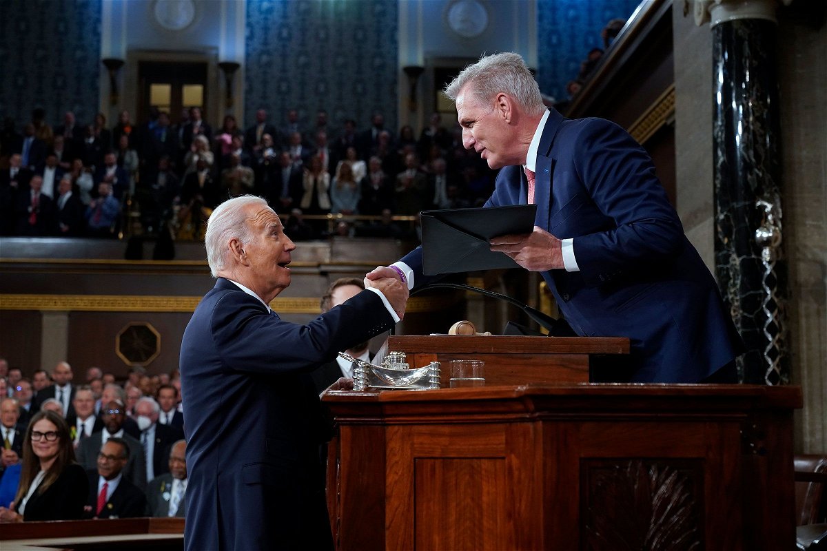 <i>Jacquelyn Martin/Pool/Getty Images</i><br/>President Joe Biden shakes hands as he presents a copy of his speech to House Speaker Kevin McCarthy before he delivers his State of the Union address to a joint session of Congress