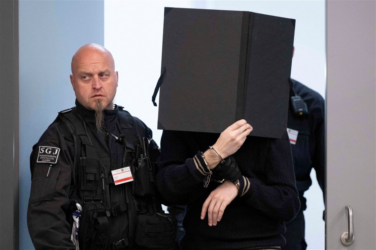 <i>Sebastian Kahnert/Pool/AFP/Getty Images</i><br/>A defendant is brought to the courtroom on May 16