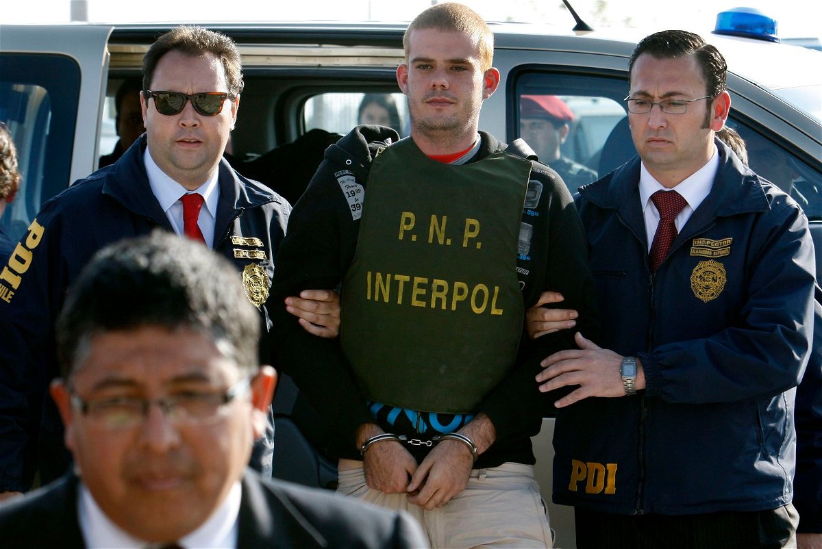 <i>Karel Navarro/AP</i><br/>Chilean police officers escort Joran Van der Sloot to a police station in June 2010.