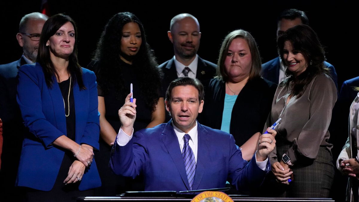 <i>Wilfredo Lee/AP</i><br/>Florida Gov. Ron DeSantis on Wednesday signed into law new restrictions on trans Floridians’ access to treatments and bathrooms. DeSantis is pictured here during a signing ceremony at Lighthouse Point