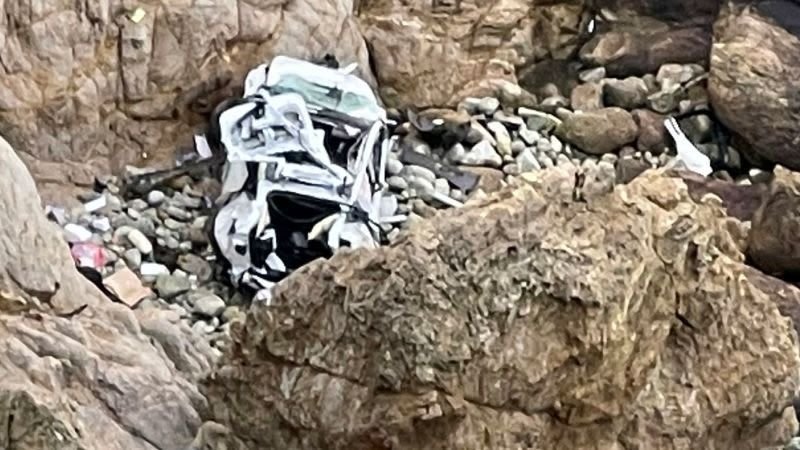 <i>San Mateo County Sheriff's Office/KGO</i><br/>This image from the San Mateo County Sheriff's Office shows the Tesla on a rocky beach below the cliffs