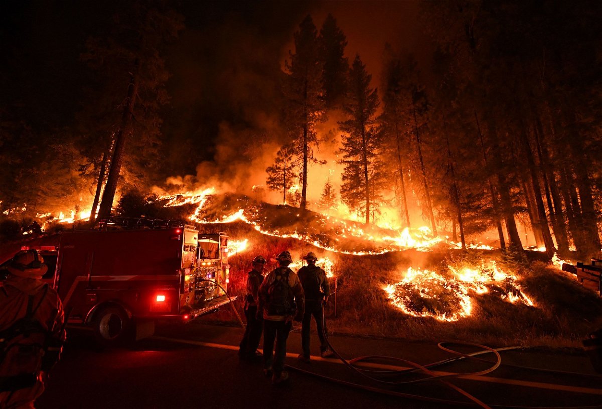 <i>Mark Ralston/AFP/Getty Images</i><br/>Firefighters try to control a back burn as the Carr fire continues to spread towards the towns of Douglas City and Lewiston near Redding