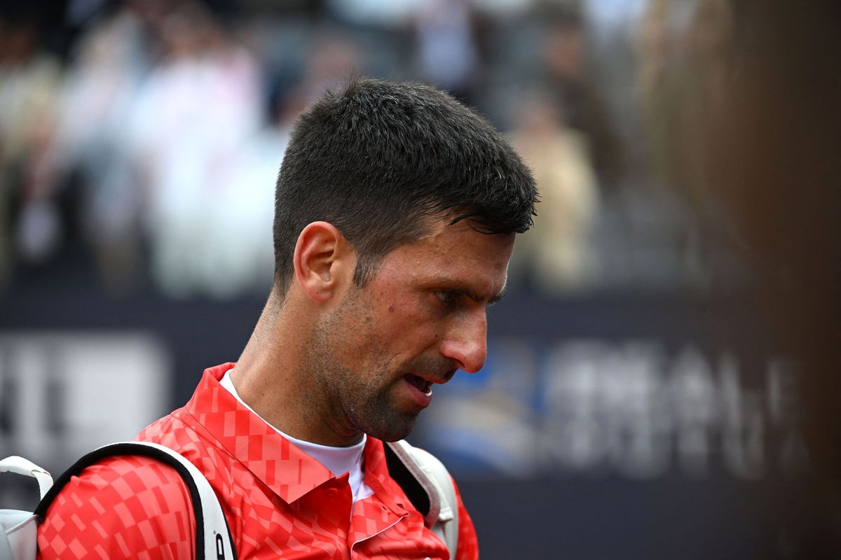 <i>Filippo Monteforte/AFP/Getty Images</i><br/>Novak Djokovic leaves the court after losing his quarterfinal match against Denmark's Holger Rune.