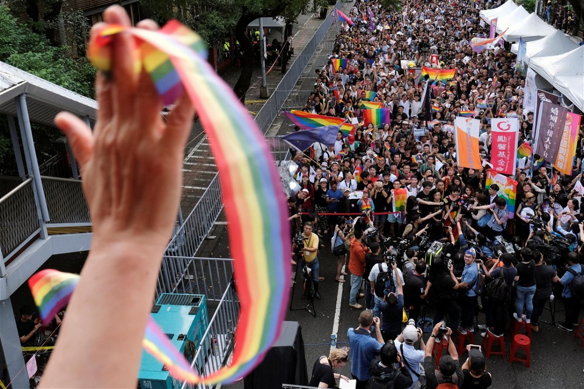 <i>Tyrone Siu/Reuters/File</i><br/>Same-sex marriage supporters celebrate in Taipei after Taiwan became the first place in Asia to legalize same-sex marriage in 2019. The country has on Tuesday granted same-sex couples the right to adopt.