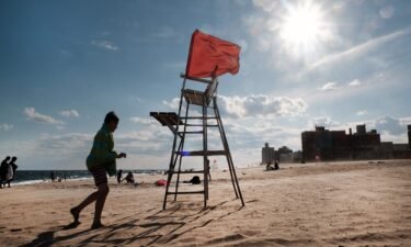 An empty lifeguard chair stands at Coney Island