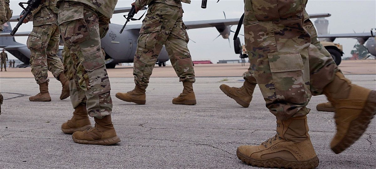 <i>Eric Gay/AP/FILE</i><br/>This file photo shows members of the Texas National Guard prepare to deploy to the Texas-Mexico border in Austin