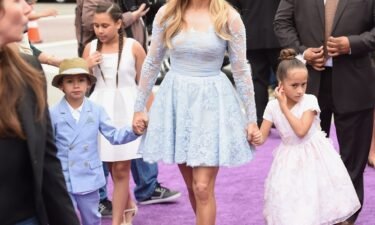 Jennifer Lopez (C) wishes she could protect her kids from having famous parent. The actress is pictured here with son Maximilian David Muniz (L) and daughter Emme Maribel Muniz (R) in 2015