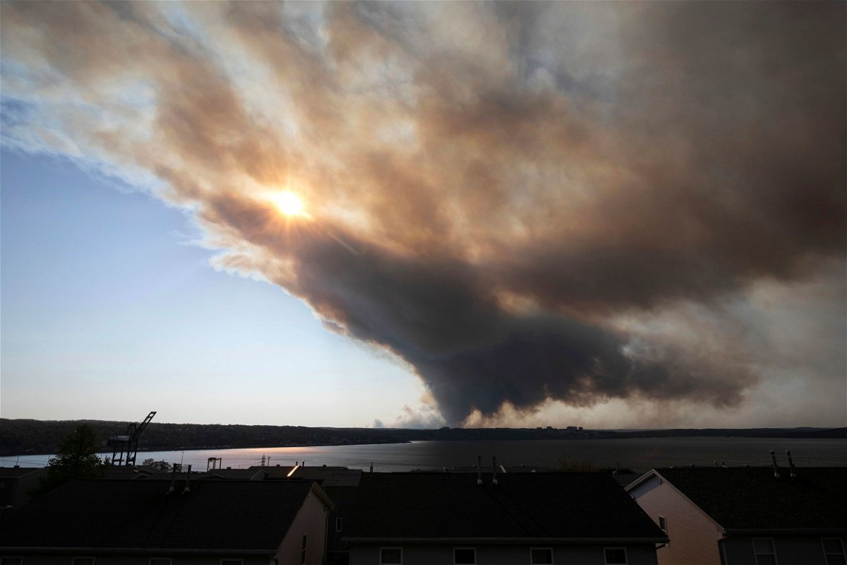 <i>Kelly Clark/The Canadian Press/AP</i><br/>A thick plume of smoke wafts from an out-of-control fire that engulfed multiple homes in Halifax