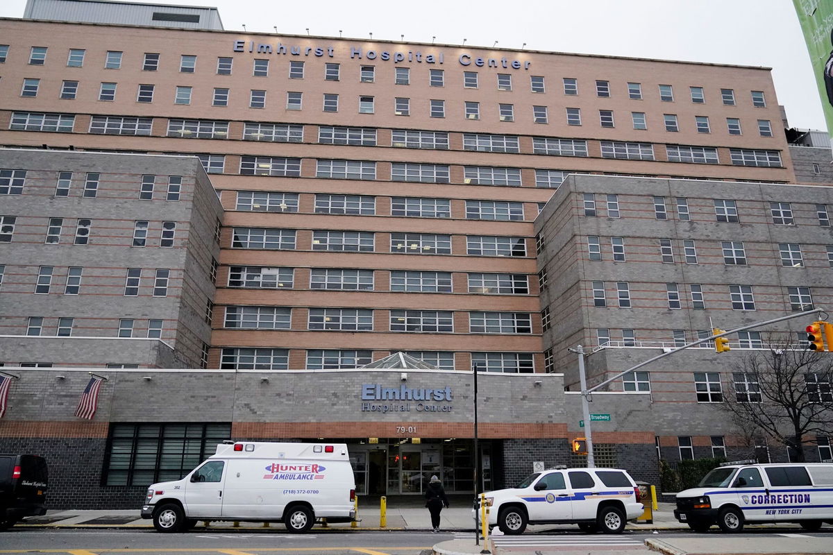 <i>Frank Franklin II/AP</i><br/>A pedestrian crosses the street near Elmhurst Hospital Center on December 16