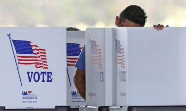 Conservative “election integrity” activists worked to kill the effort to protect election workers from harassment. Voters cast their ballots at a polling station in Kissimmee