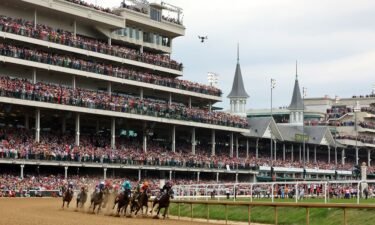 The field heads into the first turn during the 149th running of the Kentucky Derby at Churchill Downs on May 6 in Louisville