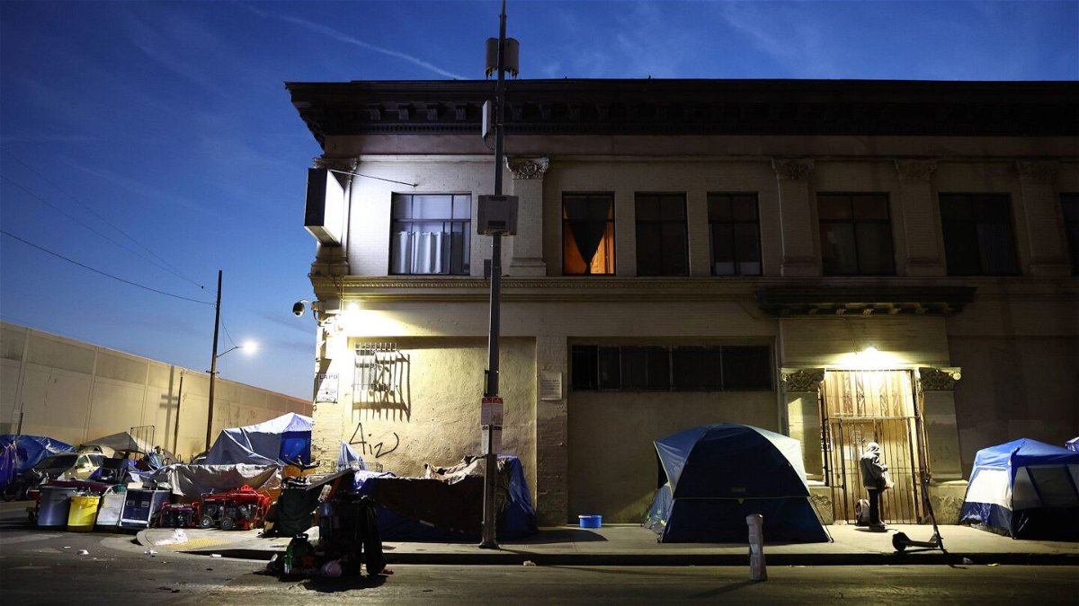 <i>Mario Tama/Getty Images/File</i><br/>The Biden administration Thursday announced new steps to help reduce homelessness. Pictured is an encampment for the homeless in 2022 in Los Angeles.
