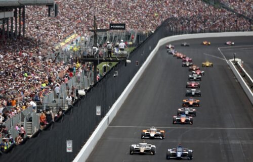 Drivers vie for position early in Sunday's race at the Indianapolis Motor Speedway.