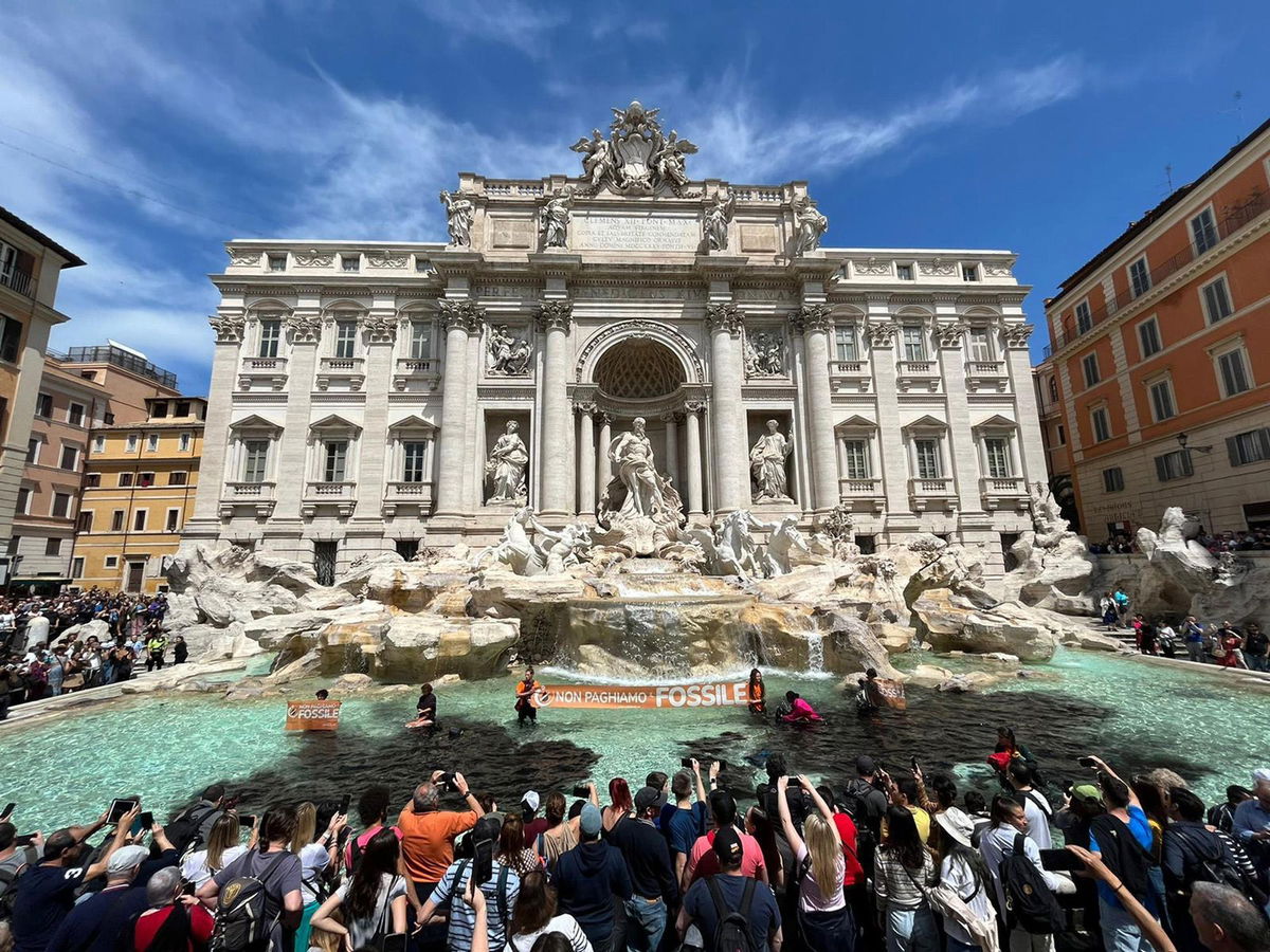 <i>Giulia Marrazzo/EPA-EFE/Shutterstock</i><br/>Climate activists from the group Last Generation stand inside the Trevi Fountain in Rome