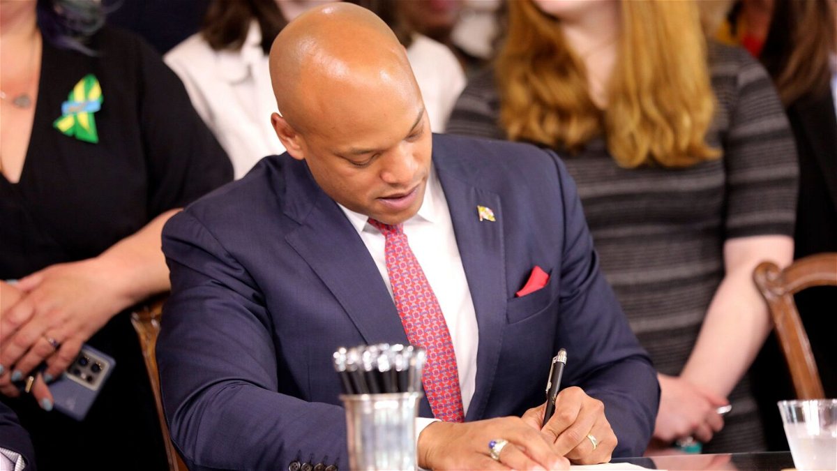 <i>Brian Witte/AP</i><br/>Maryland Gov. Wes Moore signs one of several gun-control measures during a bill-signing ceremony on Tuesday