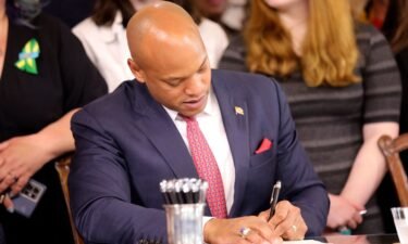 Maryland Gov. Wes Moore signs one of several gun-control measures during a bill-signing ceremony on Tuesday