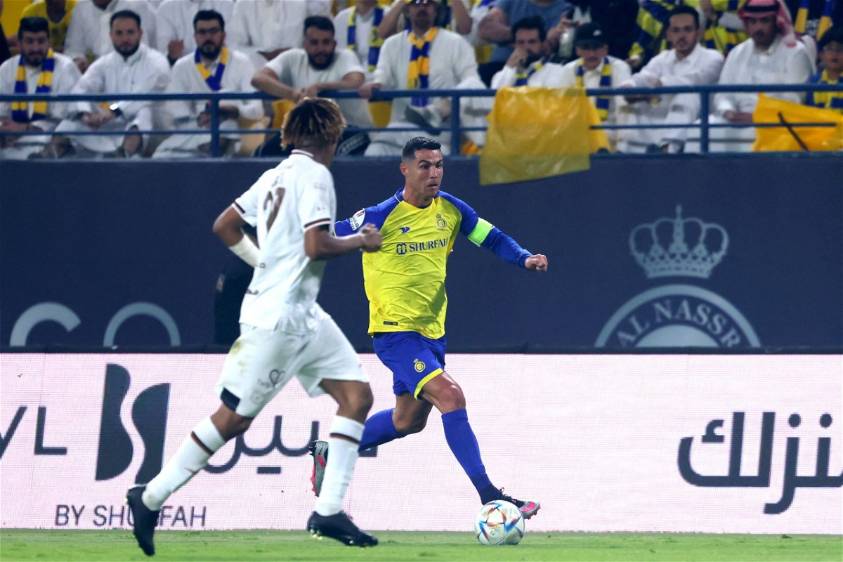 <i>Fayez Nureldine/AFP/Getty Images</i><br/>Shabab defender Fawaz al-Sqoor defends against Portuguese forward Cristiano Ronaldo during the Saudi Pro League match between Al-Nassr and Al-Shabab on May 23.