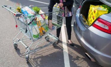 Britain’s stubbornly high inflation is a major drag on its economy. A shopper loads groceries into a car in Sheffield