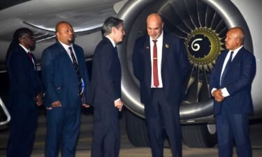 Papua New Guinea's Deputy Prime Minister John Rosso greets US Secretary of State Antony Blinken in Port Moresby on May 21.