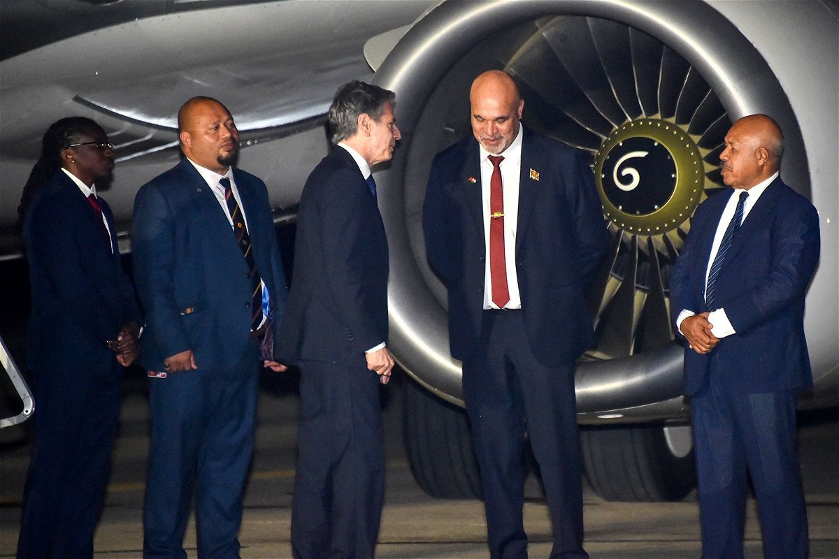 <i>Andrew Kutan/AFP/Getty Images</i><br/>Papua New Guinea's Deputy Prime Minister John Rosso greets US Secretary of State Antony Blinken in Port Moresby on May 21.