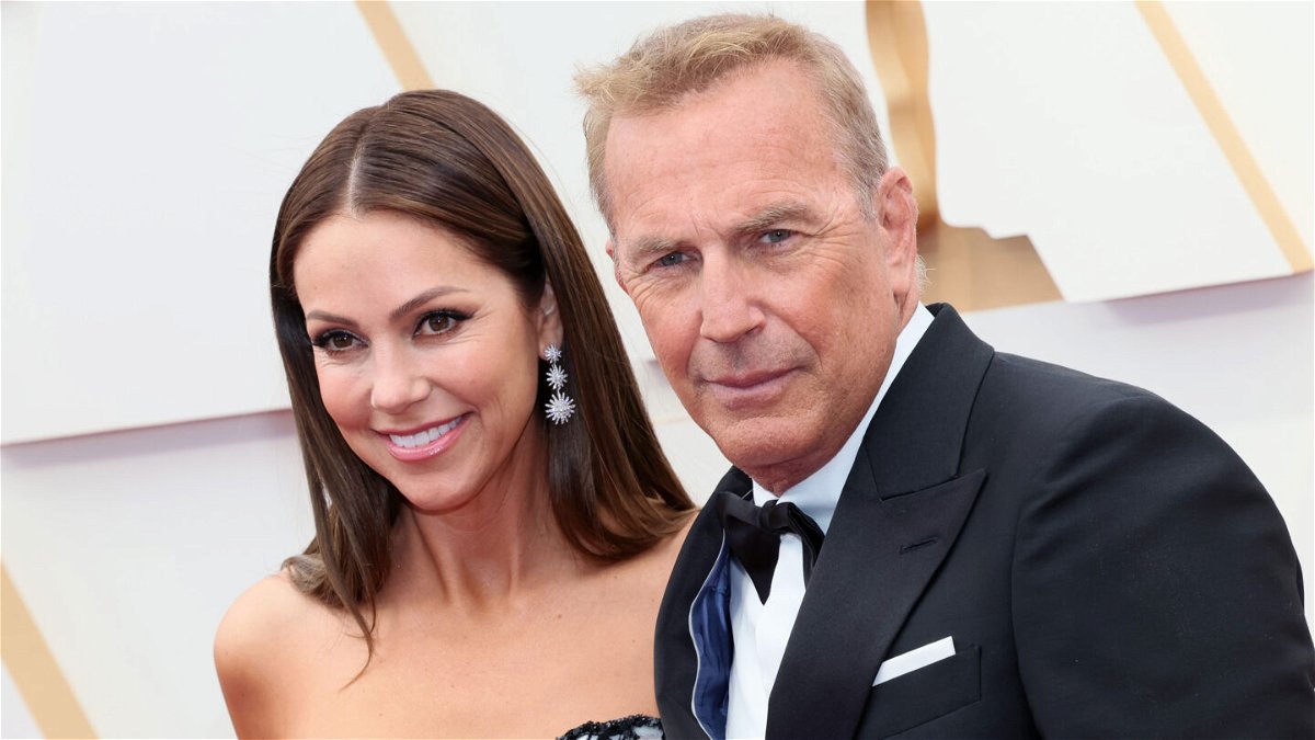 <i>David Livingston/Getty Images</i><br/>Kevin Costner and his wife of over 18 years Christine Baumgartner have announced they are going their separate ways. Baumgartner and Costner are seen here at the 94th Annual Academy Awards in March 2022 in Los Angeles.