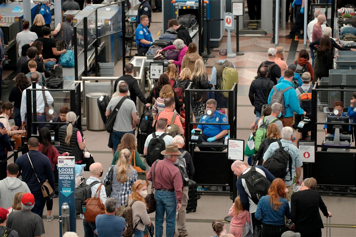 <i>David Zalubowski/AP</i><br/>AAA says this Memorial Day weekend could be the busiest at airports since 2005. Pictured are travelers at Denver International Airport in 2022