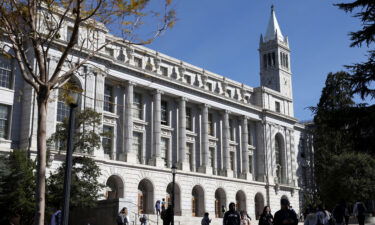 People walk by Wheeler Hall on the University of California Berkeley campus in March 2022