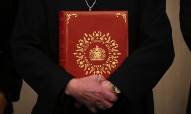 The Archbishop of Canterbury Justin Welby poses with the Coronation Bible