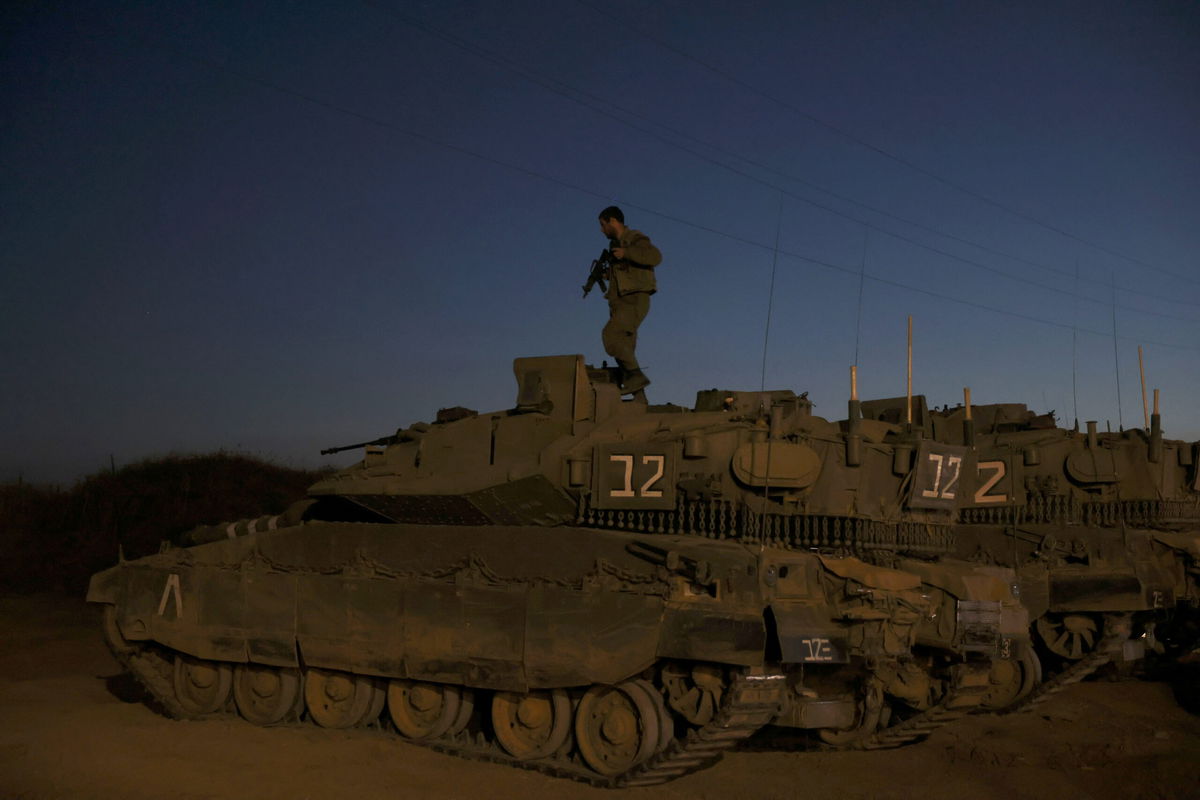 <i>Ahmad Gharabli/AFP/Getty Images</i><br/>Israeli soldiers are seen here along the Gaza border on May 2. The Israel Defense Forces (IDF) said it conducted strikes on the Gaza Strip on Tuesday.