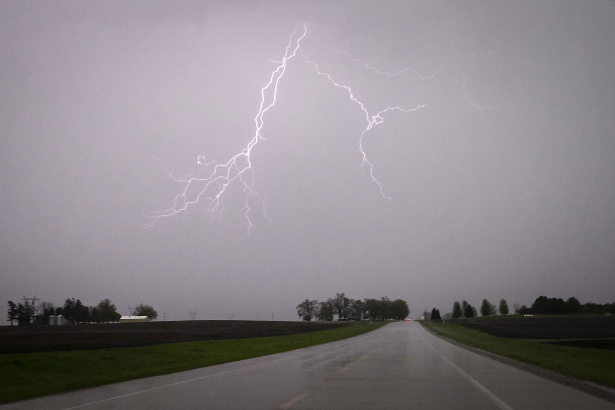 <i>Joseph Cress/Iowa City Press-Citizen/AP</i><br/>Lightning streaks across the sky Sunday during a severe thunderstorm near Lone Tree