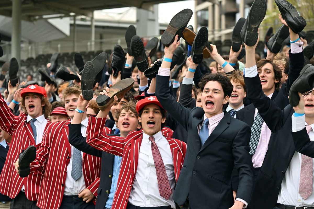 <i>Glyn Kirk/AFP/Getty Images</i><br/>Eton schoolboys cheer on their team from the stands.