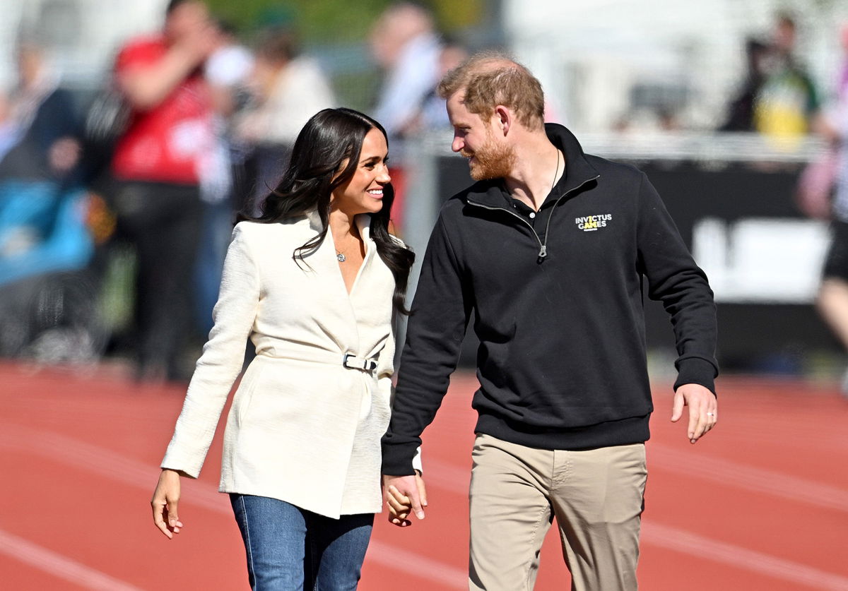 <i>Samir Hussein/WireImage/Getty Images</i><br/>Prince Harry (right) and Meghan (left) are among those members of the royal family rated most favorably by young people.