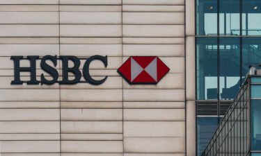 HSBC announced it had tripled its quarterly profit Tuesday. HSBC logo is seen on a building in Warsaw