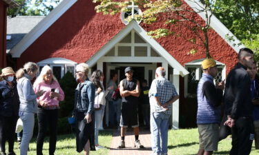 Volunteers mingle outside of St. Andrews Episcopal Church after two planes of migrants from Venezuela arrived on Martha's Vineyard in September 2022. Florida Gov. Ron DeSantis is taking steps to once again send migrants to Democratic-led cities.