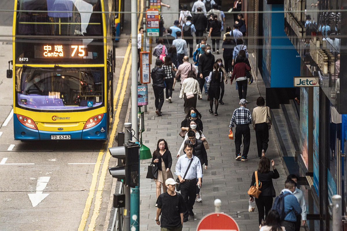 <i>Lam Yik/Bloomberg/Getty Images</i><br/>Pedestrians along a road in Hong Kong on April 24.