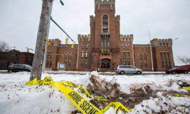 Police tape remains on the ground outside of the Main Street Armory on Monday