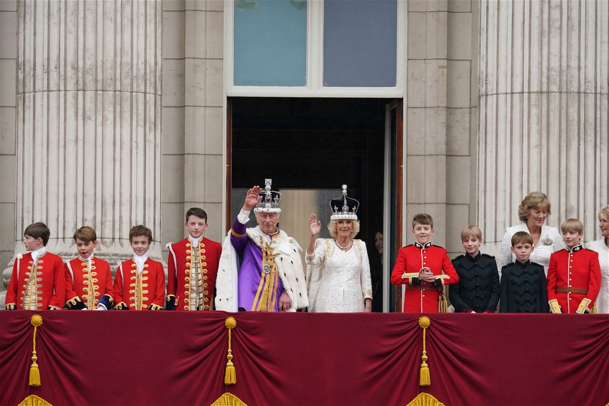 <i>Owen Humphreys/PA/AP</i><br/>King Charles III and Queen Camilla on the balcony of Buckingham Palace